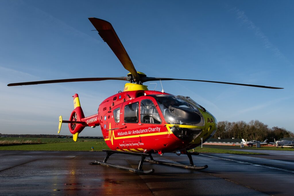 Promo shot of the Midlands Air Ambulance Aircraft siting on the heli-pad