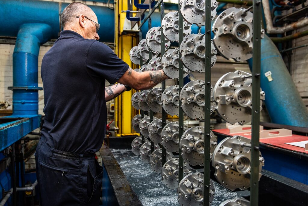 Industrial Photography at Poeton in Gloucester - worker checking components after dipping tank