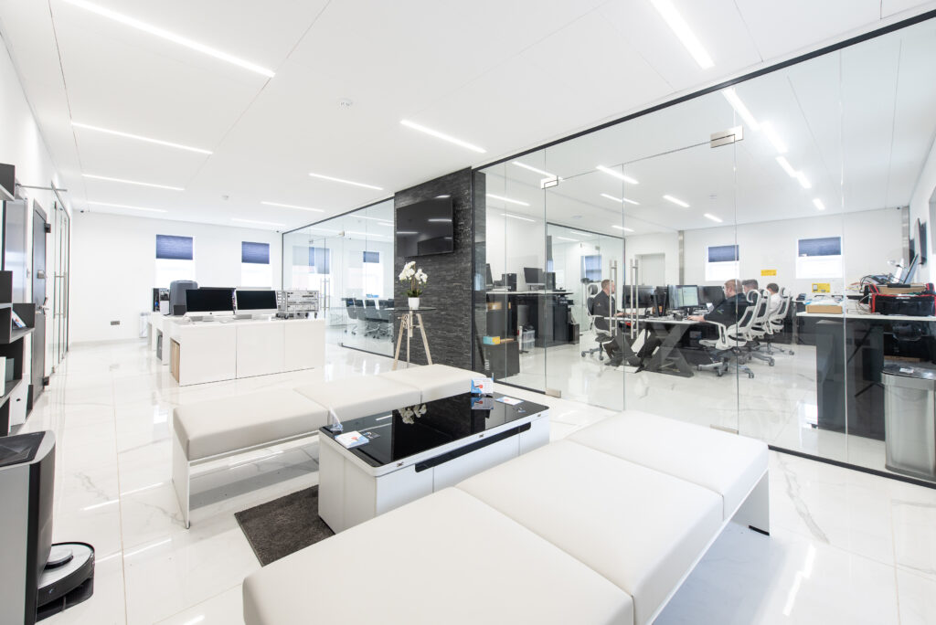 Industrial photography of a smart office space with sofas and glass walls