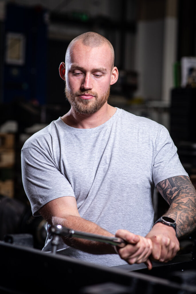 On location headshot of a man at work in an industrial setting